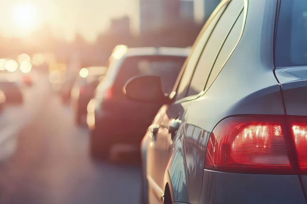 Traffic jam during sunset with cars lined up on a highway.