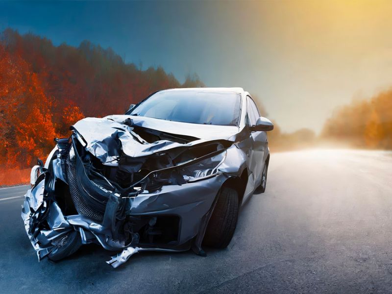 Crashed car on a rural road, symbolizing the consequences of reckless driving in Newport News, VA. Legal help for reckless driving cases.