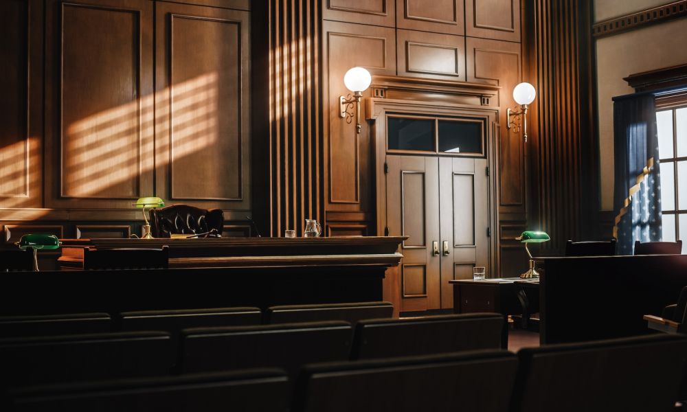 Empty American Style Courtroom. Supreme Court of Law and Justice Trial Stand. Courthouse Before Civil Case Hearing Starts. Grand Wooden Interior with Judge's Bench, Defendant's and Plaintiff's Tables.