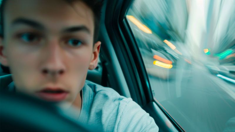 Young driver appearing distracted or impaired, illustrating reckless driving risks in Newport News, VA. Legal guidance for reckless driving cases.