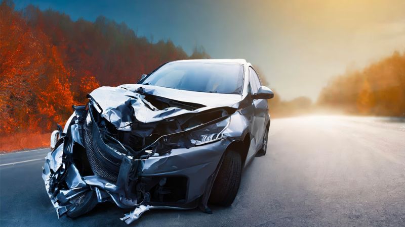 Crashed car on a rural road, symbolizing the consequences of reckless driving in Newport News, VA. Legal help for reckless driving cases.