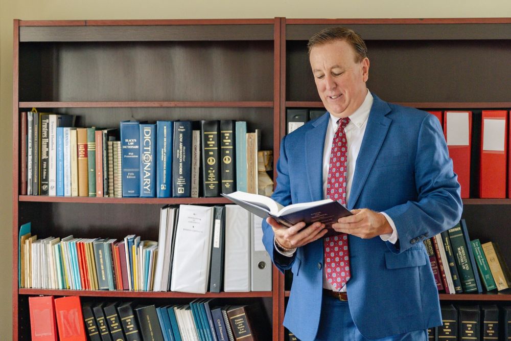 Anthony Montagna reading a law book