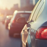 Traffic jam during sunset with cars lined up on a highway.